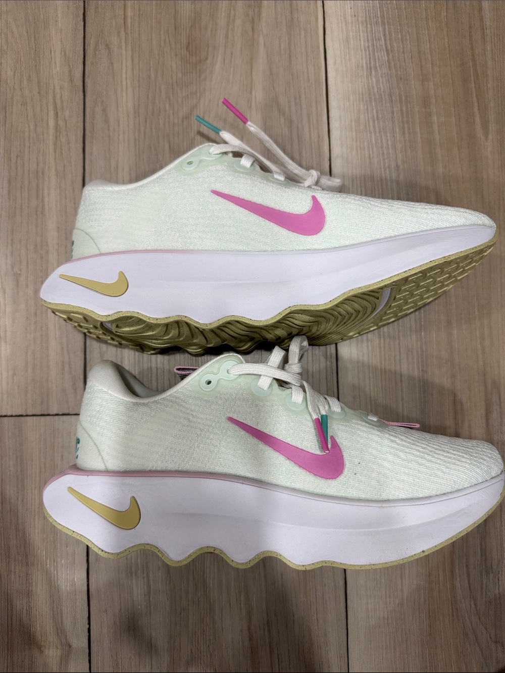 Nike Women’s Mint Green Sneakers with Pink Swoosh and Gold Accents